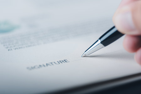 Young businessman hand using pen to sign signature, contract agreement concept, employment, acceptance and approval in business. Legal Document Managementの写真素材