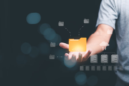 A businessman manages his organization's document database through the cloud. cyberspace technology concept and large important documents, file management and paperless online storageの写真素材