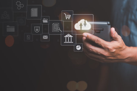 Cloud computing concept, smartphone in man's hand, digital network data connection technology, modern communication with information technology, innovation online backup with highly secure protectionの写真素材