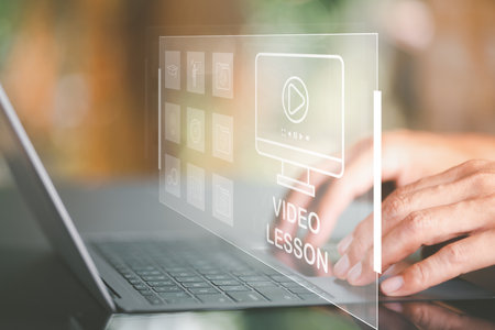 e-learning,online internet education and learning,learning new things,adding new career skills,personal development plan make business successful,business people use laptops to watch video lessonsの写真素材