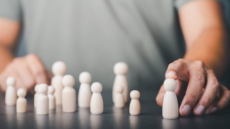 Young man pointing to a wooden doll, HR management concept, team leader selection, growth success and achievement, Leadership and Excellence.の写真素材