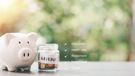 financial growth and investment ideas sustainable income and profit planning retirement preparation future fund management,Coin jar and piggy bank placed on the tableの写真素材
