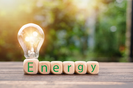protecting the environment alternative energy Sustainable renewable energy sources Green energy innovation and environmentally friendly energy technology,wooden block is placed in front of the lampの写真素材