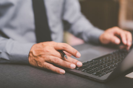 Businessmen check information from laptops, business management ideas and financial strategies, view...