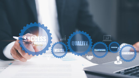 Businessman pointing to an icon representing business success steps. organization development concept Leadership management for employees Professional teamwork for growth and transformation goals.の写真素材