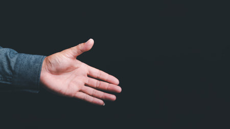 business people offer hands to shake hands and cooperate,business agreement proposal concept,assistance,invitation acceptance,の写真素材