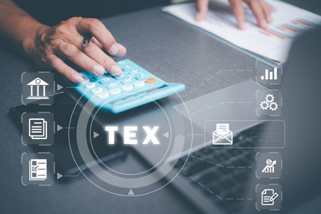 Auditor using working calculator, balance sheet management concept. verification form Budget management and meeting minutes management annual tax calculationの写真素材