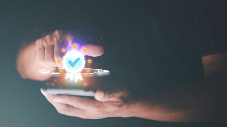 Businessman holding a smartphone and showing the best quality assurance for product warranty standard quality concept business insurance industry certification Product Certification Managementの写真素材