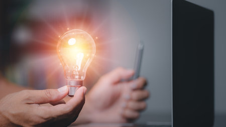 Businessman holding a light bulb showing ideas to brainstorm, imagine, inspire, innovative...