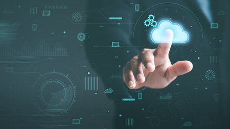 A young businessman uses cloud networking technology to communicate and connect data servers around...
