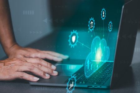 A young businessman uses cloud networking technology to communicate and connect data servers around...
