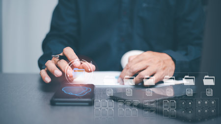 Businessman manages corporate document database through cloud, big data cyberspace technology concept, paperless archives and large documents, file management and online storage.の写真素材