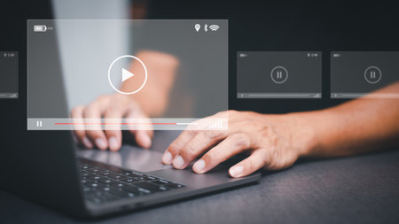 man searching for information to watch various videos ,streaming onlinewatching video on internet, live concert, show or tutorial,webinars online business trainingの写真素材