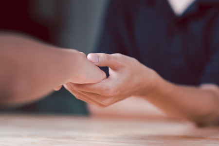 Husband and wife join hands to cheer ,Relationship care concept ,comforting family members ,mutual encouragement ,tenderness ,comfort and sympathy ,helping ,giving hope and believingの写真素材