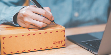 concept of selling products online ,order management in online stores, shopping on the internet ,Selling online on the Internet ,Write shipping address from customer ,order in online store ,SMEの写真素材