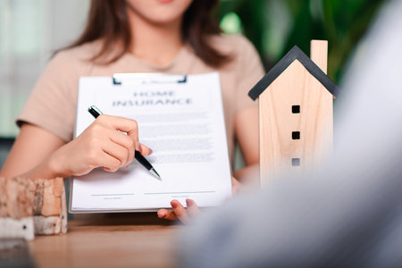 Home insurance concept and bank loan approval contract ,real estate business ,appraisal property value ,Finding location invest in real estate ,mortgages and bank loans ,Buying real estateの写真素材