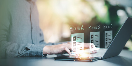 Strategic Planning Concepts ,brainstorm ideas on business plans ,Updating schedules or planning business online ,teamwork and data analysis ,solution and marketing development ,document managementの写真素材