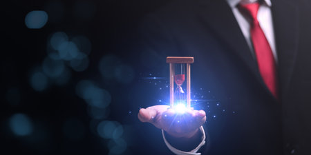 hourglass on businessman hand, time management concept ,effective business planning ,time management organization ,Agreement and solution ,end of deal ,profitable use of time ,appointment punctualityの写真素材
