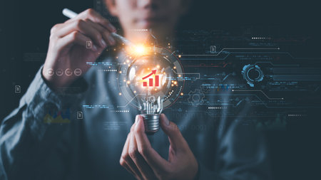 Businessman showing business growth and success graph ,concept of progress in development, financial efficiency and investment with business strategy for goals and opportunities in industry futureの写真素材