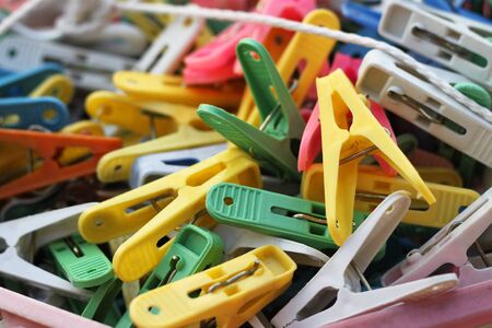 colorful clothes pegs piled up