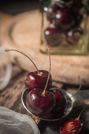 Cherries on a wooden Board, still life in rustic styleの写真素材