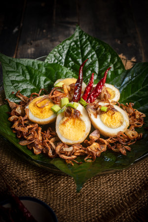 Fried boiled egg with tamarind sauce (Son-in-law Eggs), closeupの写真素材