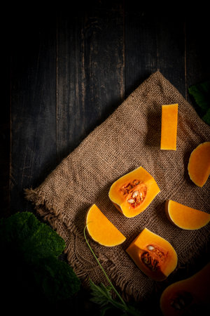 Butternut squash on a dark wooden backgroundの写真素材