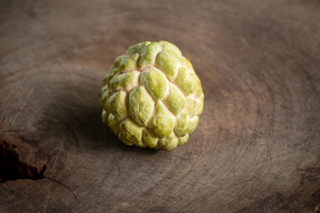 Custard Apple on old wood, vintage still life style image.の写真素材