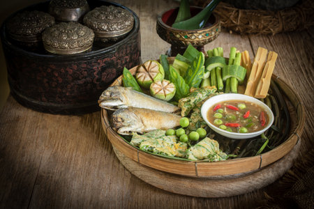 Thai shrimp paste chili dip with fried mackerel and boiled vegetables, traditional Thai food still lifeの写真素材