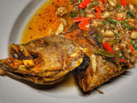 Deep fried grouper fish with sweet and sour chili sauceの写真素材
