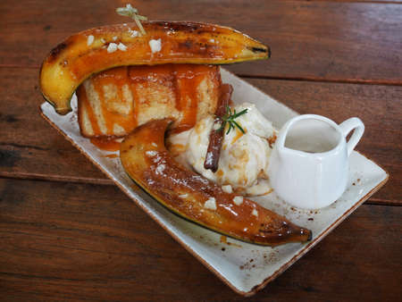 Caramel Banana Toast on wood tableの写真素材