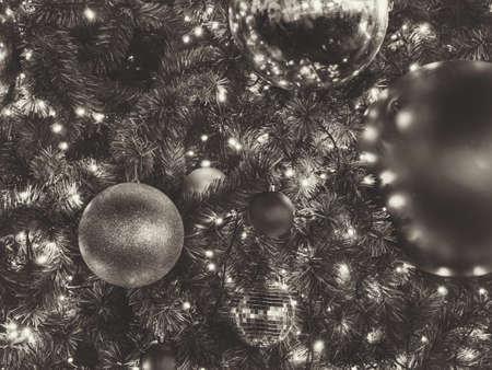 Many gold and red ornament shiny ball on Green Christmas tree. Can use for background and add text.の写真素材