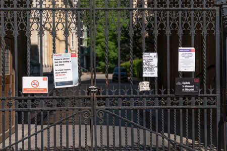 Royal Courts of Justice in London, Strand, England closed due to Coronavirus COVID-19 surrounded by...