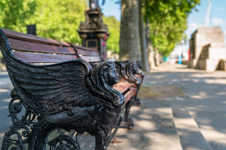Young asian couple walking along the Embankment in London, England wearing maks in the Coronavirus COVID-19 pandemic lockdown enjoying the sun - 1のeditorial素材