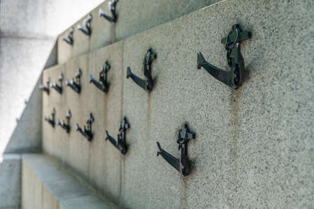 Couple walking along the Embankment in London, England wearing maks in the Coronavirus COVID-19 pandemic lockdowncrossing the road - 1のeditorial素材