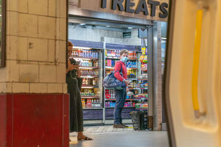 LONDON, ENGLAND - JULY 3, 2020:  Social Distancing being practiced by train passengers during the...