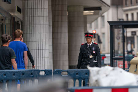 LONDON, ENGLAND - JUNE 3, 2020:  Young male asian traffic warden wearing an uniform during the...