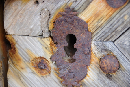 Old door lock of an alpine hutの写真素材