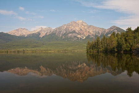Pyramid Lake with Pyramid Island and a mountain reflecting in the quiet watersの写真素材