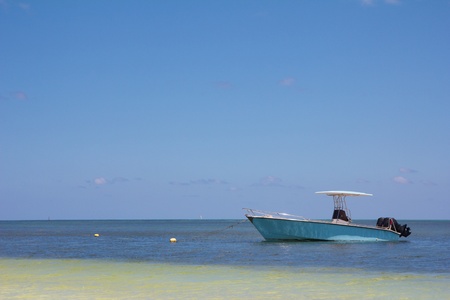 Lonely boat at the shore of Praslin island, Seychelles