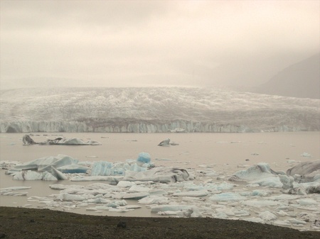 Icebergs on Jokulsarlon glacier lake, Iceland, with the glacier