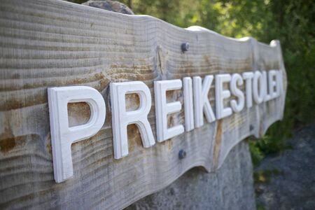 Wooden signpost pointing towards the Preikestolen hiking trail, Norwayの写真素材