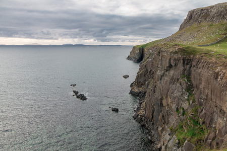 Dramatic Neist Point cliff, a famous landmark with a lighthouse near Glendale, Isle of Skye,...