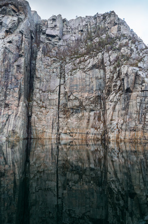 View into beautiful Norwegian Lysefjord on a cold and cloudy winter dayの写真素材