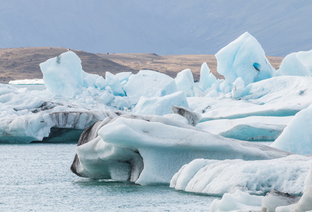 Icebergs swimming on world famous Jokulsarlon glacier lagoon in southern Iceland