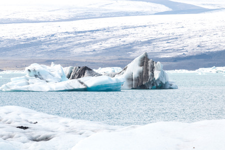 Icebergs swimming on world famous Jokulsarlon glacier lagoon in southern Iceland