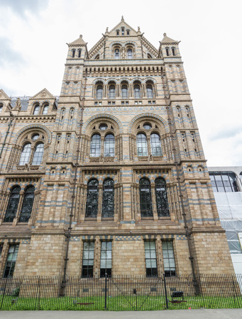 Exterior of the world famous London Natural History Museum under a grey skyのeditorial素材