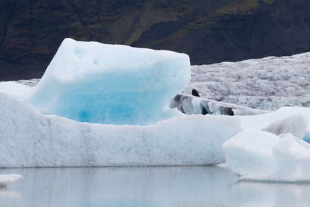 Famous Fjallsarlon glacier and lagoon with icebergs swimming on the water, close to Jokulsarlon,...