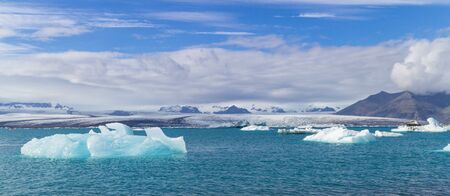 Icebergs swimming on world famous Jokulsarlon glacier lagoon in southern Iceland