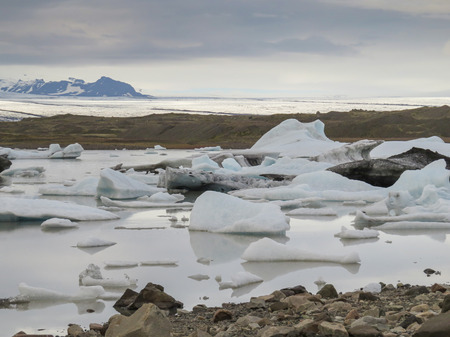 Famous Fjallsarlon glacier and lagoon with icebergs swimming on the water, close to Jokulsarlon,...